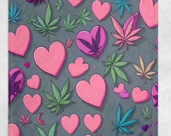 May include: A gray blanket with a repeating pattern of pink hearts and cannabis leaves in various colors, including green, blue, and purple. The design is a playful and colorful illustration.