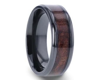 May include: A black ceramic ring with a brown wood inlay. The ring is a classic style with a smooth finish.