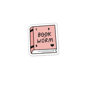 May include: A pink book sticker with the text "BOOK WORM" in black. The sticker has a small heart and two stars on it.