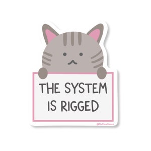 Le système est un autocollant en vinyle truqué pour chat, un autocollant drôle de chat anarchiste, un autocollant de protestation politique mignon pour ordinateur portable, un journal ou une bouteille d'eau