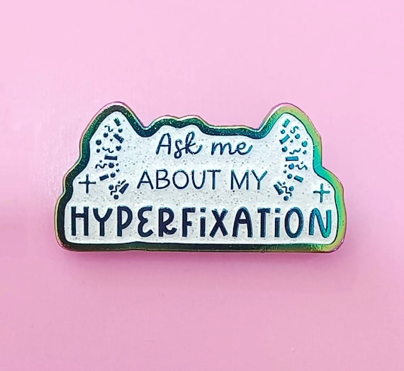Ask me about my hyperfixation rainbow glitter enamel pin