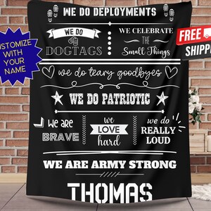 May include: Black blanket with white text. The blanket reads "We Do Deployments," "We Do Dogtags," "We Celebrate The Small Things," and "We Are Army Strong." The name "Thomas" is at the bottom. A blue starburst says "Customize With Your Name."