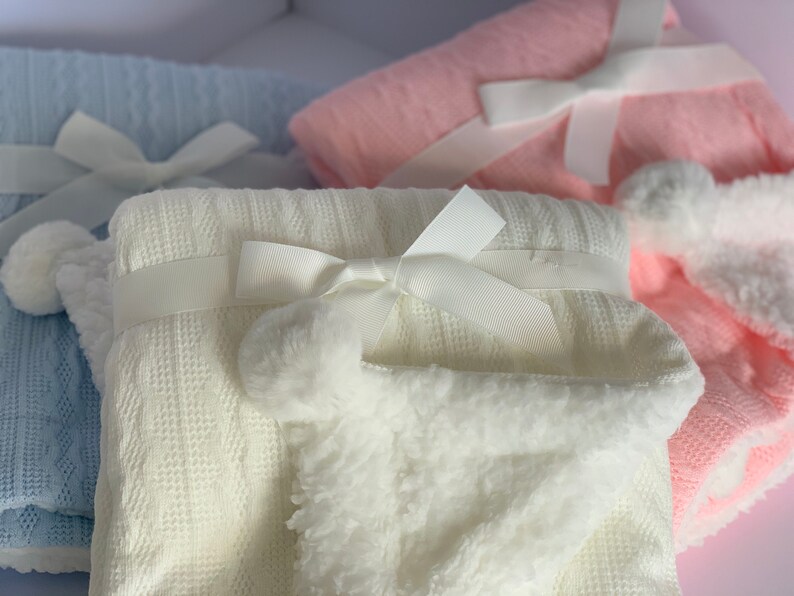 Personalised knitted pom pom fleece lined baby blanket