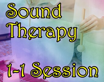May include: A person is playing a large, white singing bowl with a wooden mallet. The text "Sound Therapy 1-1 Session" is in yellow letters on a colorful background.