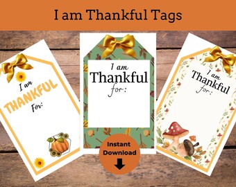 May include: Three printable Thanksgiving tags with a fall theme. Each tag has a yellow bow and the text "I am Thankful for:" with a blank space to write in. The tags have different fall-themed borders: sunflowers and a pumpkin, acorns and leaves, and mushrooms and leaves.