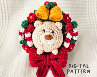 May include: Crochet pattern for a Christmas wreath with a cute pig in the center. The wreath is decorated with red and green candy canes, red berries, and yellow bells. The pig is wearing a red bow.