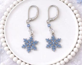 Pendientes colgantes de copo de nieve de plata con detalles de cristal azul