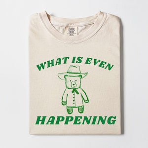 Vad händer ens rolig t-shirt, meme-tröja, ohängd tröja, konstig tröja, vsco-tröja, trendig skjorta i bekväma färger, grafisk unisex-tröja