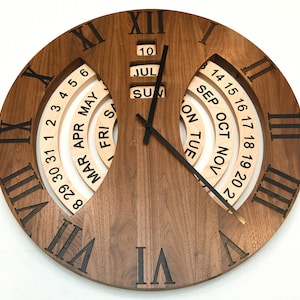 May include: A wooden wall clock with Roman numeral markings and a calendar dial. The calendar dial has days of the week and months of the year. The clock face is brown with black Roman numerals and black hands.