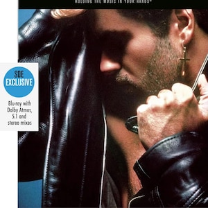 May include: Blu-ray disc with Dolby Atmos, 5.1, and stereo mixes. The image features a person wearing a black leather jacket. The text on the image reads "SDE SURROUND SERIES" and "HOLDING THE MUSIC IN YOUR HANDS&reg;".