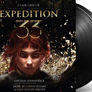 May include: A vinyl record album cover for "Expedition 33" features a portrait of a person with red hair and a crown. The album title is in gold lettering. The record is black and partially visible. The album is an original soundtrack.