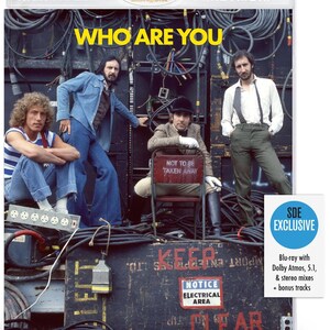 May include: Blu-ray disc of "Who Are You" by The Who. The cover features the band members in a backstage setting with cables and equipment. The disc includes Dolby Atmos, 5.1, and stereo mixes, plus bonus tracks.