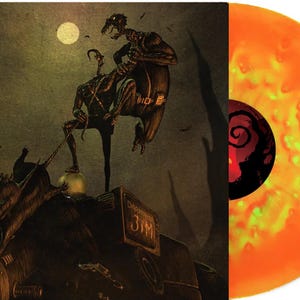 May include: Vinyl record with a cover featuring an illustration of two dark figures on a vehicle under a moonlit sky. The record itself is orange and yellow. The album art has a dark, gothic theme.