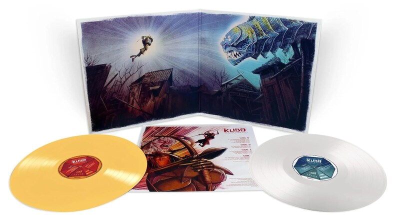 May include: A vinyl record set featuring artwork from the movie "Kubo and the Two Strings." The set includes two vinyl records, a gold and a silver one, and a gatefold album cover with illustrations of characters and scenes from the film.