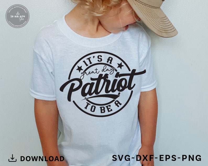 May include: A white t-shirt with a black circle design that says "It's a great day to be a Patriot".