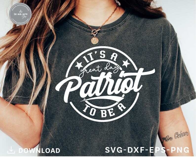May include: A gray t-shirt with a white circle design that says "It's a great day to be a Patriot" in a vintage style font.
