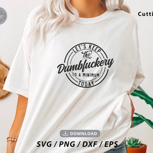 May include: White t-shirt with a black circle graphic that says "Let's Keep The Dumbluckery To A Minimum Today".