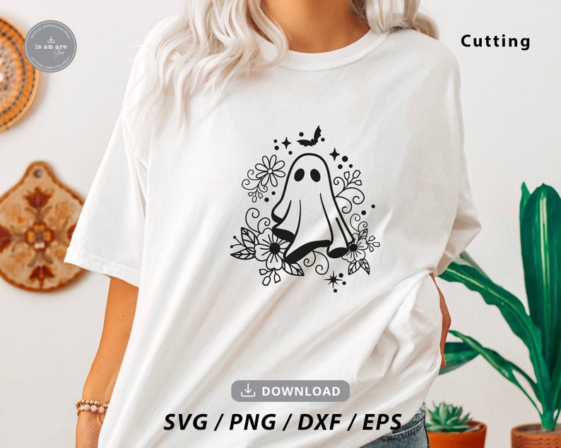 May include: A white t-shirt with a black and white design of a ghost with flowers and a bat. The text "Cutting" is in the top right corner of the image. The text "SVG/PNG/DXF/EPS" is in the bottom center of the image.