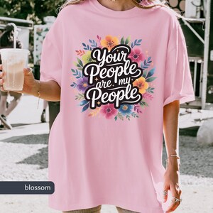 Jewish Comfort Colors T-shirt with Book of Ruth Bible Quote Your People are my People in handwritten cursive over watercolor flowers under it the text is white with black shadowing. Megillat Rut verse for Shavuot Ruth and Naomi famous quote inspiring Jewish t-shirt Biblical women gift for Jewish woman gift for Jewish man convert to Judaism Jews by choice conversion gift
