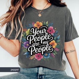 Jewish Comfort Colors T-shirt with Book of Ruth Bible Quote Your People are my People in handwritten cursive over watercolor flowers under it the text is white with black shadowing. Megillat Rut verse for Shavuot Ruth and Naomi famous quote inspiring Jewish t-shirt Biblical women gift for Jewish woman gift for Jewish man convert to Judaism Jews by choice conversion gift
