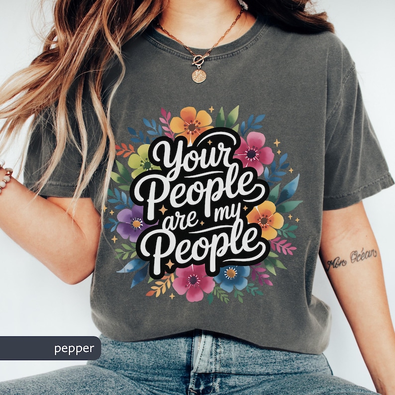 Jewish Comfort Colors T-shirt with Book of Ruth Bible Quote Your People are my People in handwritten cursive over watercolor flowers under it the text is white with black shadowing. Megillat Rut verse for Shavuot Ruth and Naomi famous quote inspiring Jewish t-shirt Biblical women gift for Jewish woman gift for Jewish man convert to Judaism Jews by choice conversion gift