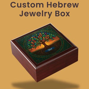 May include: A wooden jewelry box with a stained glass design featuring a colorful tree of life. The box is dark brown with a rectangular shape and the name "Yael" on a blue plaque. The text "Custom Hebrew Jewelry Box" is at the top.