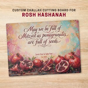 May include: A rectangular cutting board featuring a colorful painted background of pomegranates and the text: CUSTOM CHALLAH CUTTING BOARD FOR ROSH HASHANAH, May we be full of Mitzvot as pomegranates are full of seeds, Savta Tzipi & Saba Yoel Est. 2027.