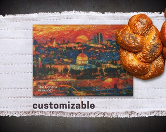 May include: A customizable canvas print featuring an impressionistic painting of a cityscape with a sunset. The print includes the text "The Cohens 08.06.2027" and the word "customizable". A braided loaf of bread with sesame seeds is next to the print.