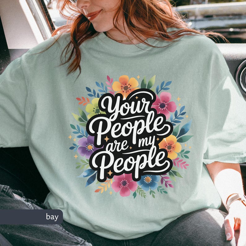 Jewish Comfort Colors T-shirt with Book of Ruth Bible Quote Your People are my People in handwritten cursive over watercolor flowers under it the text is white with black shadowing. Megillat Rut verse for Shavuot Ruth and Naomi famous quote inspiring Jewish t-shirt Biblical women gift for Jewish woman gift for Jewish man convert to Judaism Jews by choice conversion gift