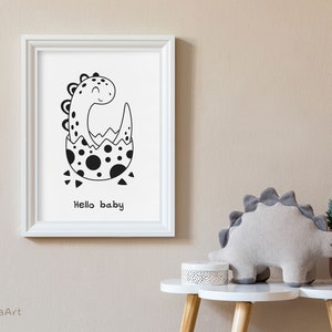 May include: Black and white illustration of a dinosaur hatching from an egg. The dinosaur is smiling and the text "Hello baby" is below the image.