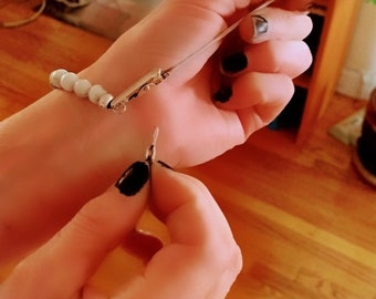 Bracelet assist tool Free with purchase or eight dollars alone