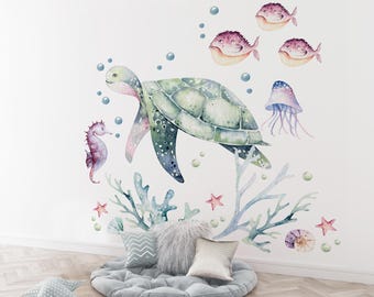 May include: A watercolour illustration of a sea turtle, a seahorse, a jellyfish, and coral. The sea turtle is green and has a brown shell. The seahorse is purple and the jellyfish is blue and purple. The coral is pink and green.