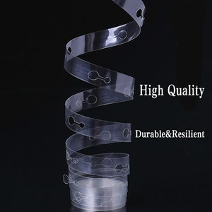 May include: Clear plastic balloon arch strip with small holes for tying balloons. The strip is coiled and has the text "High Quality Durable & Resilient" printed on the side.