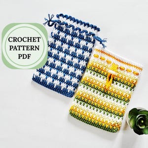 May include: Two crocheted drawstring pouches. One is blue and white with a houndstooth pattern, and the other is yellow, green, and white with horizontal stripes. The text "CROCHET PATTERN PDF" is in a green circle.