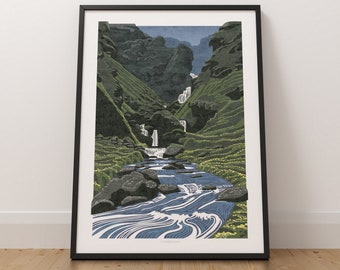May include: A black framed print of a stylized illustration of a river flowing through a green valley with waterfalls. The print is titled "Glendalough".