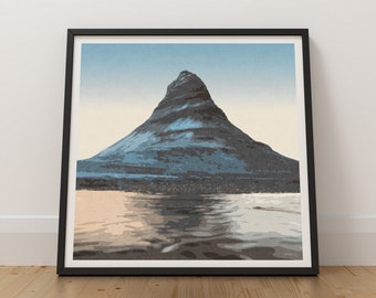 May include: A framed print of a mountain peak reflected in a body of water. The mountain is a dark blue and gray color, and the water is a light blue and gray color. The sky is a light blue color.