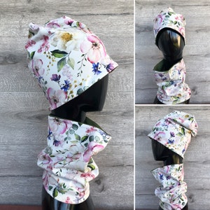 Floral kids beanie and loop. Kids jersey hat and neck warmer with bright pastel flowers print pattern.