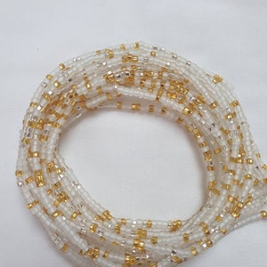 Frosted dainty white African waist beads with a hint of gold and silver