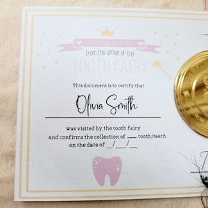 May include: A pink and gold tooth fairy certificate with a gold coin and a pink tooth graphic. The certificate reads "Official Award from the office of the Tooth Fairy" and "This document is to certify that Olivia Smith was visited by the tooth fairy and confirms the collection of tooth/teeth on the date of /__/___."