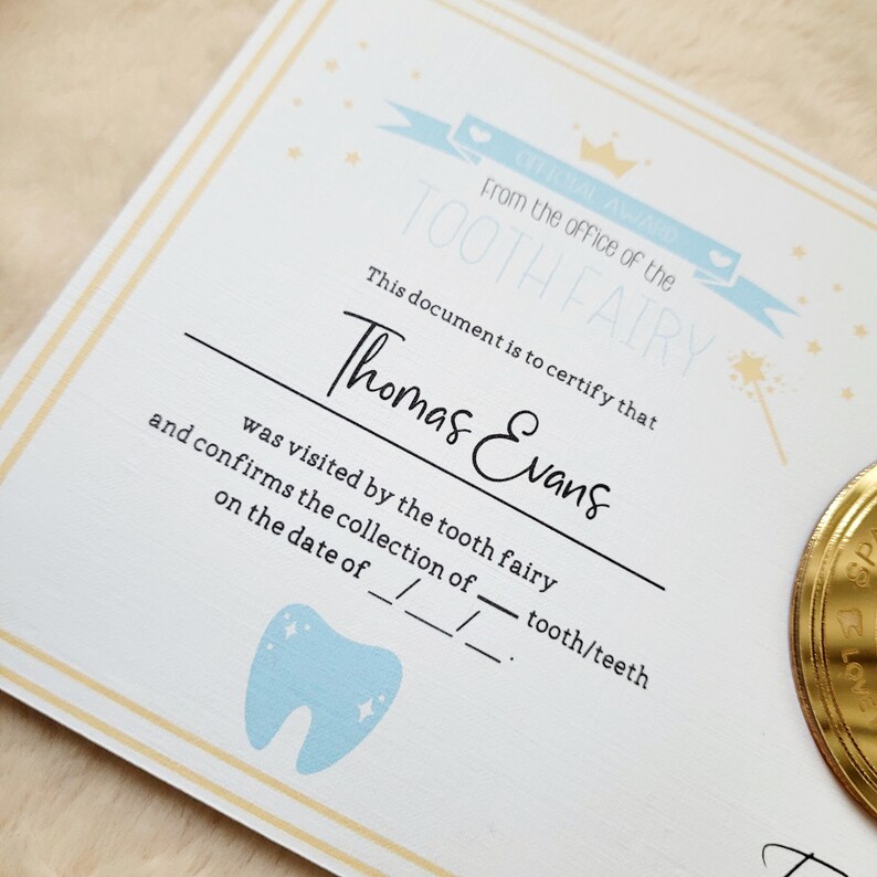 May include: A certificate from the Tooth Fairy for Thomas Evans, confirming the collection of a tooth/teeth on a specific date. The certificate features a blue tooth icon with stars and a gold coin.