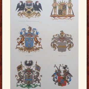 May include: A framed print featuring six heraldic crests with intricate designs. The crests display eagles, unicorns, and other symbolic figures, with text identifying each crest. The artwork is in a vintage style, with a cream-colored background.