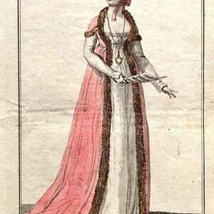 May include: An antique fashion illustration titled "Costume Parisien." The image shows a woman in a long, pink satin gown trimmed with brown fur. She wears a matching bonnet and holds a fan. The text reads "Capote de Satin Rose, Bordée en Fut. Douillette Garnie de sa Fourrure."