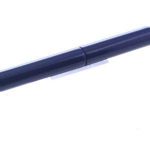May include: A dark blue pen with a silver clip.