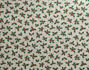 May include: White fabric with a repeating pattern of green holly leaves with red berries and gold stars.