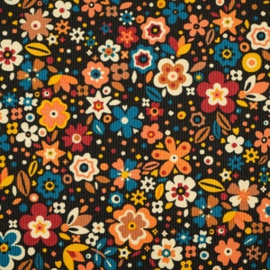 May include: A black fabric with a repeating pattern of colourful flowers. The flowers are in shades of orange, red, yellow, blue, and white. The fabric has a corduroy texture.