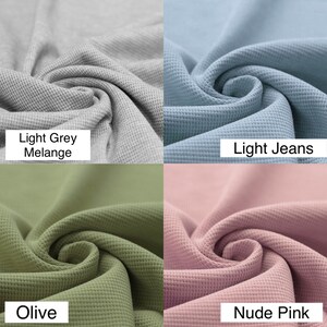 May include: Four fabric swatches in different colors: light grey melange, light jeans, olive, and nude pink. The fabric has a waffle texture.