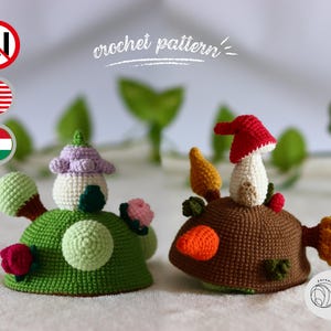 May include: Two handmade crochet mushroom figures. One is green with a purple top, the other is brown with a red cap. The image includes the text "crochet pattern".