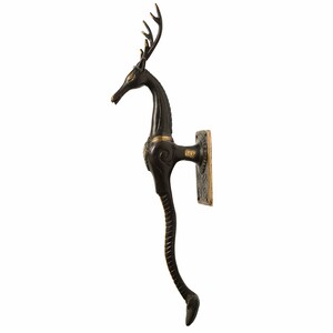 May include: Black metal door handle with a deer design. The handle has a long, curved tail and a square base with intricate details.
