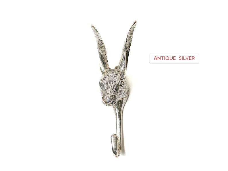 May include: Antique silver rabbit head wall hook. The hook is shaped like a rabbit's head with long ears and a detailed face.