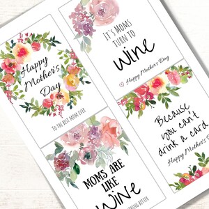 May include: Four printable Mother's Day gift tags with watercolor floral designs. The tags feature the text "Happy Mother's Day", "It's Moms Turn To Wine", "Moms Are Like Wine", and "Because You Can't Drink A Card..."